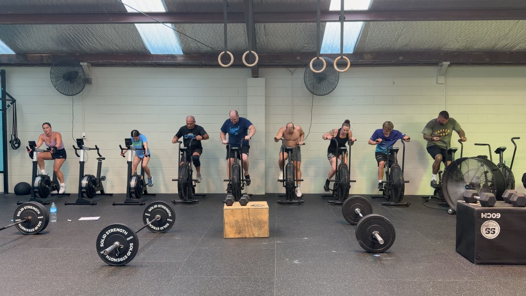 Athletes on the assault bikes during a conditioning piece at CrossFit Hibiscus Coast