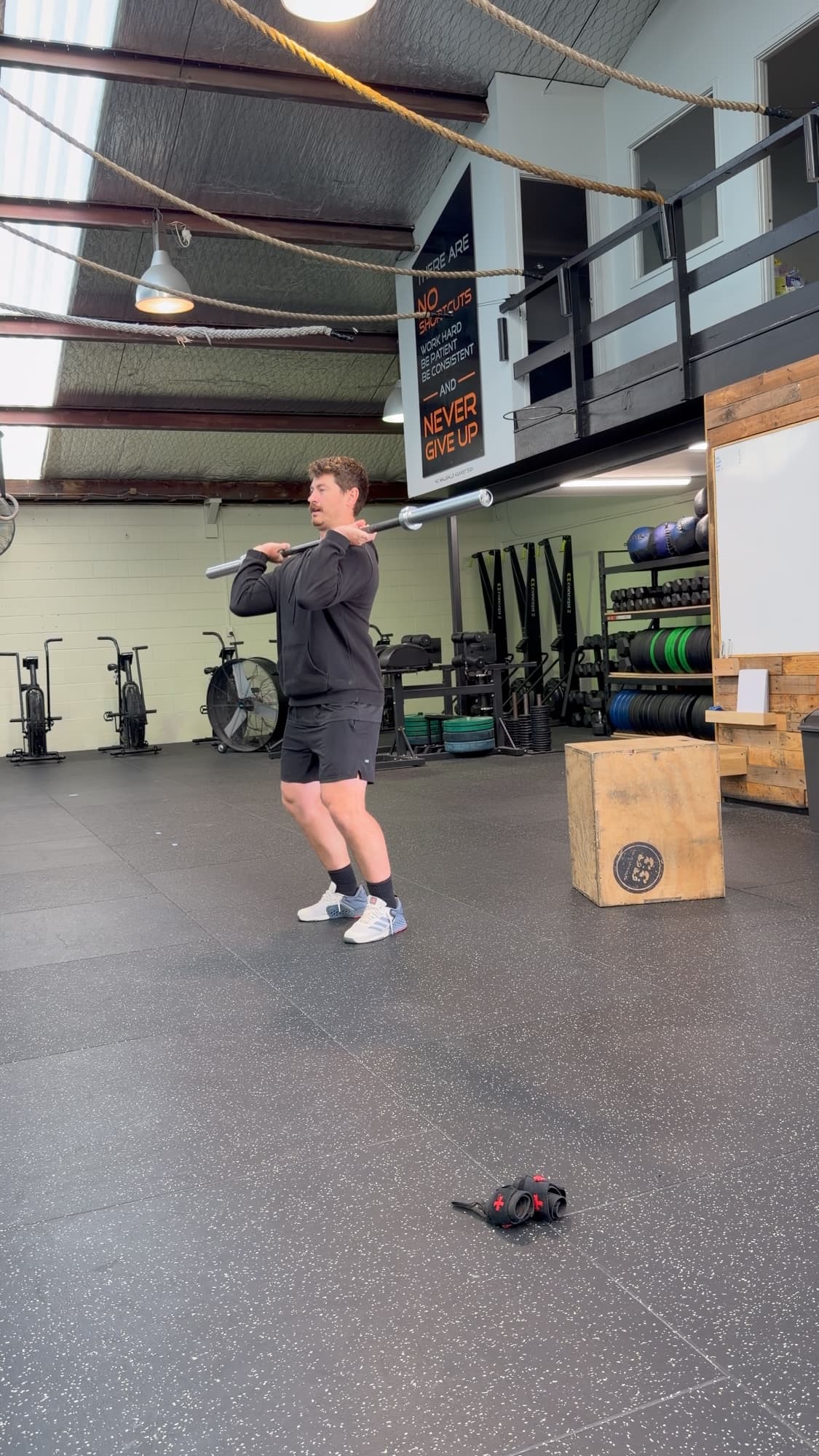 Coach Julz Halkyard demonstrating the clean at CrossFit Hibiscus Coast